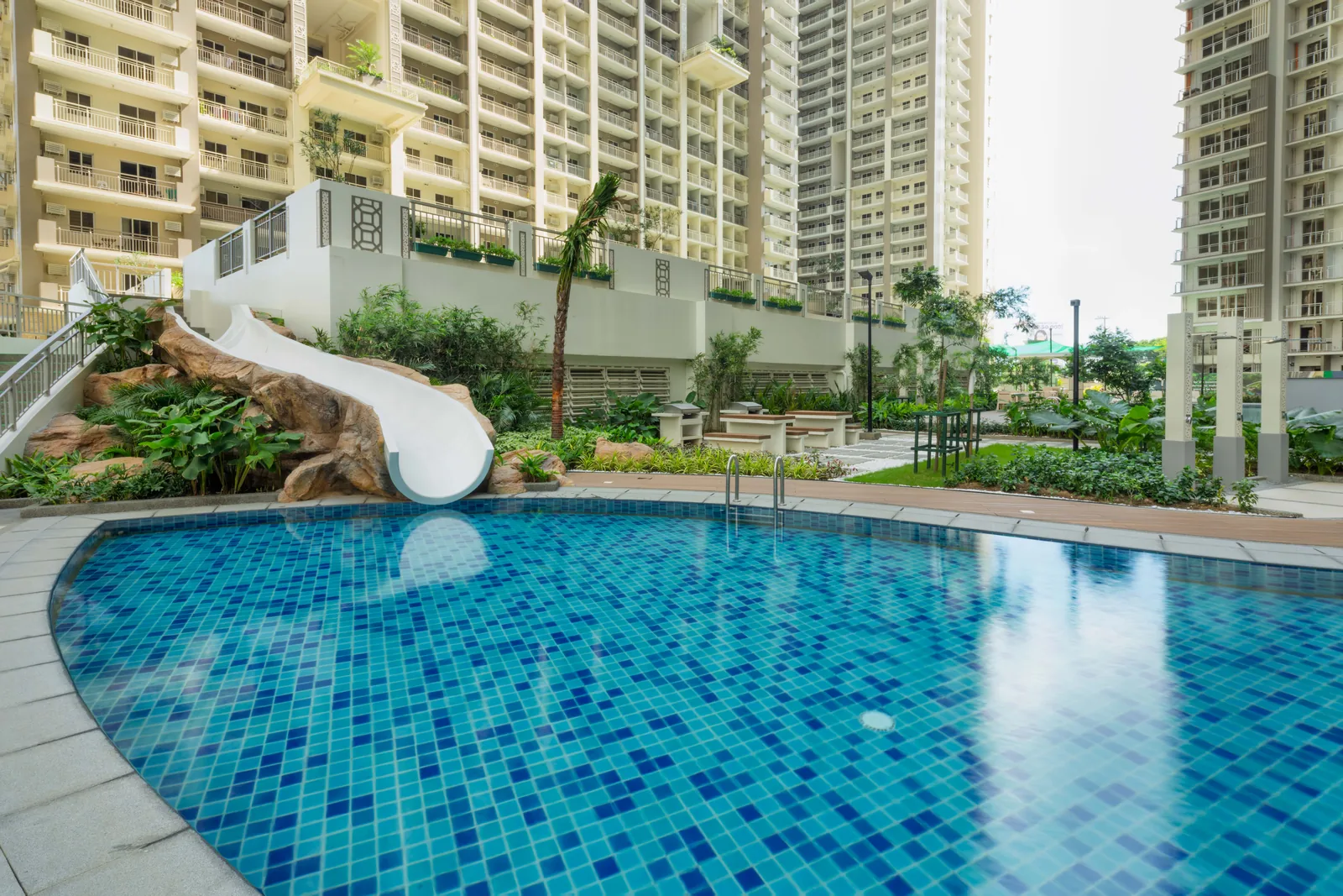 Pool with water slide at Allegra Garden Place