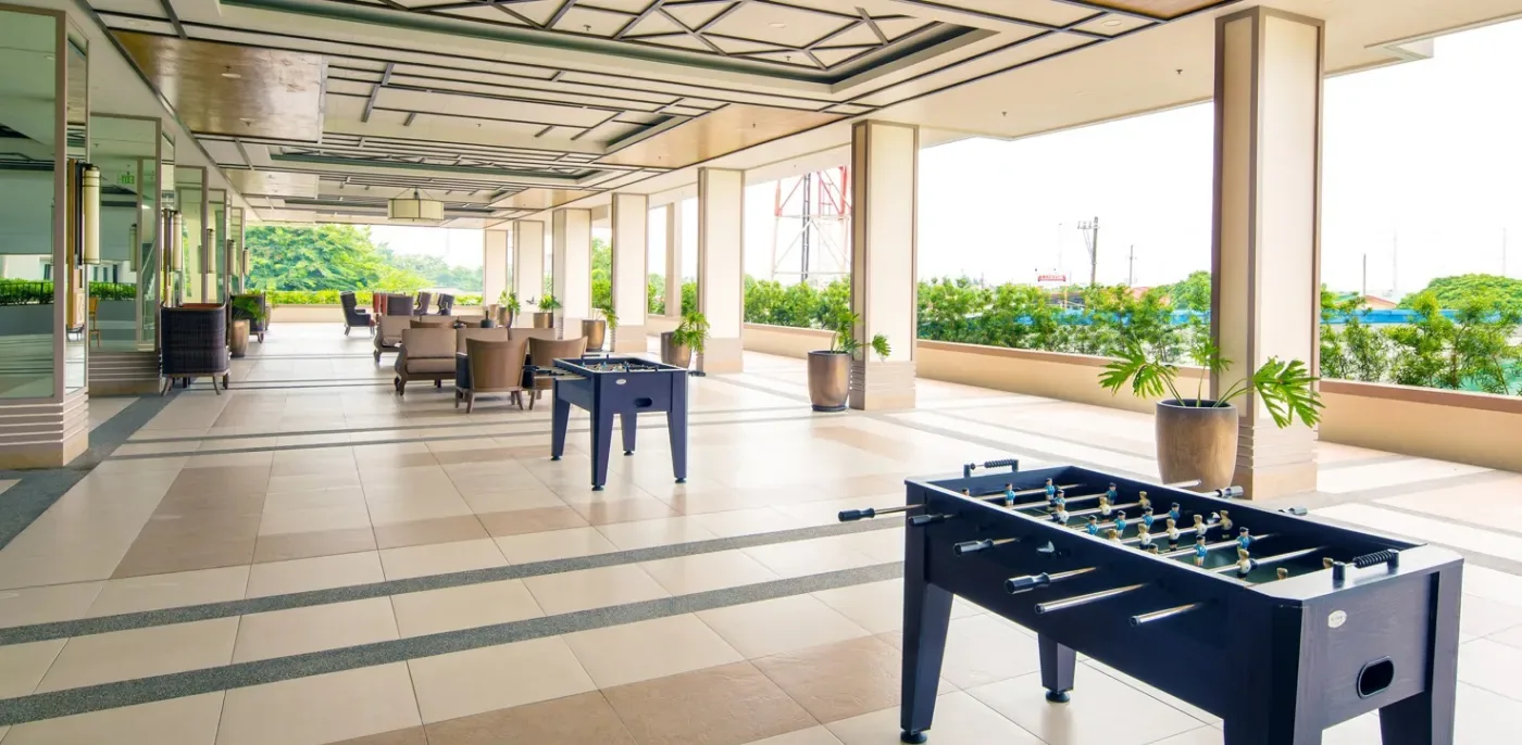 Open-air game area with foosball at Alea Residences