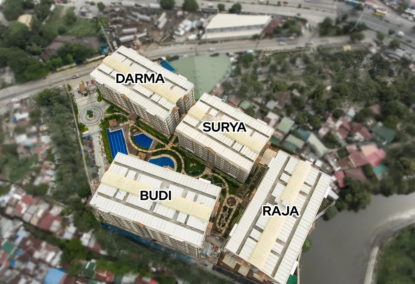 Aerial site development photo of Alea Residences showing the Darma, Surya, Budi and Raja buildings around the pool courtyard
