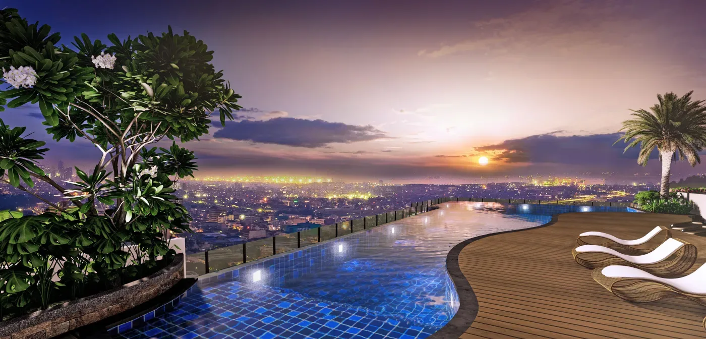 Rooftop sky deck pool at The Calinea Tower overlooking the Caloocan skyline at dusk