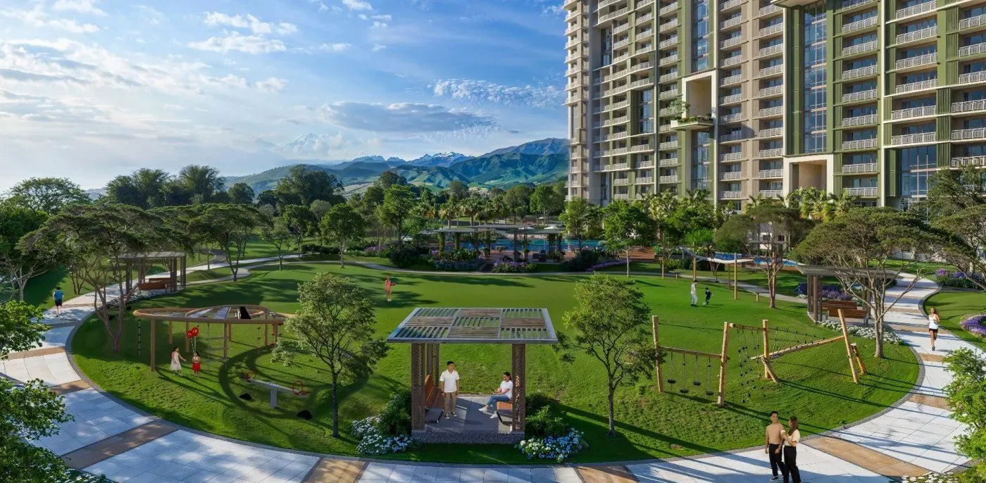 Open lawn and landscaped walk at Kalea Heights