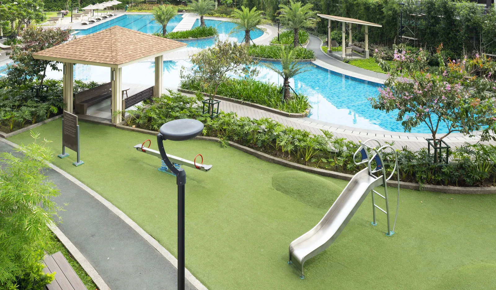The children's play area beside the lagoon pool at Prisma Residences