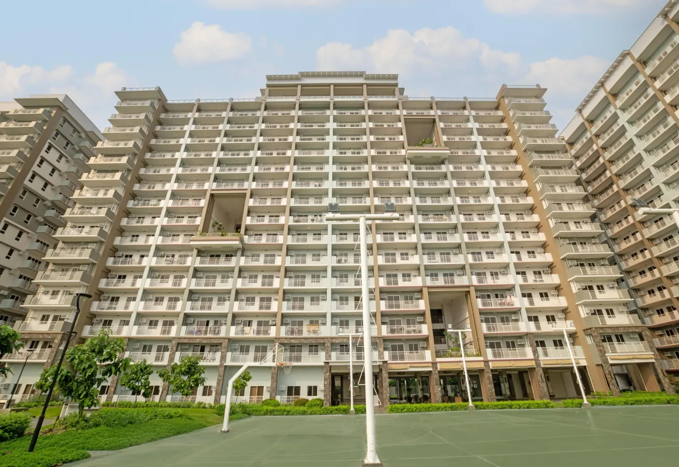 Multi-purpose court at Satori Residences with the residential towers behind