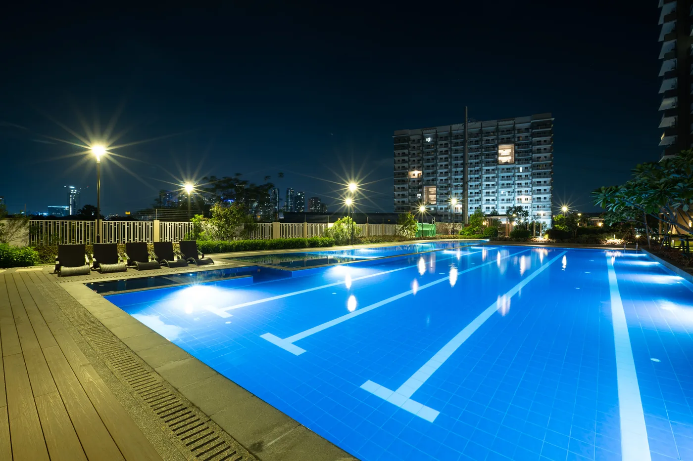 Lap pool at Satori Residences lit at night