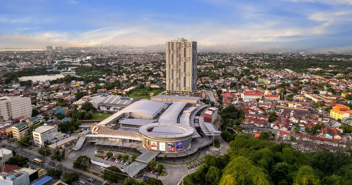 Aerial view of Robinsons Place Las Piñas with Sonora Garden Residences behind it — the integrated mall-and-residential site