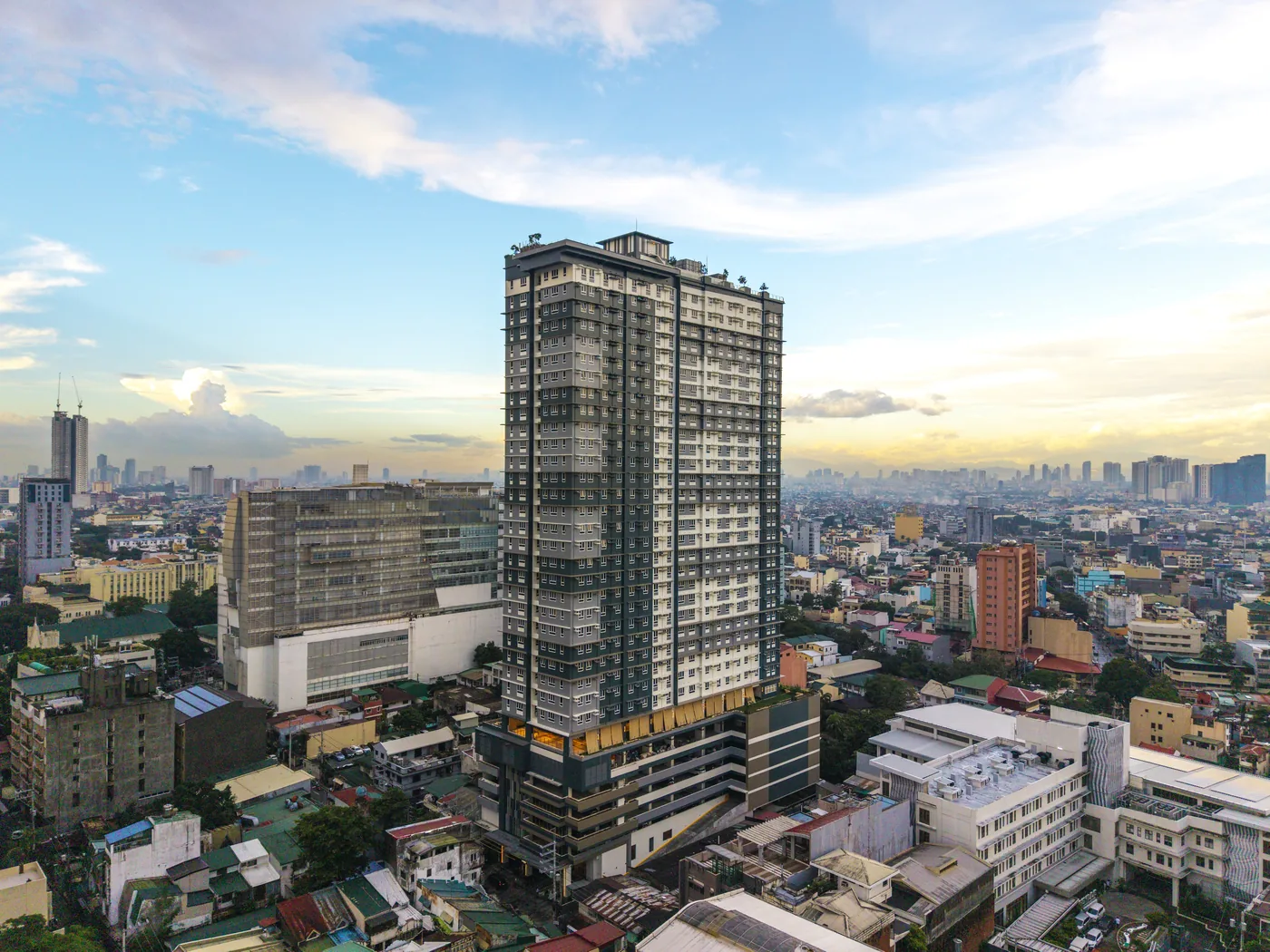 Aerial photograph of The Camden Place tower above Malate, Manila