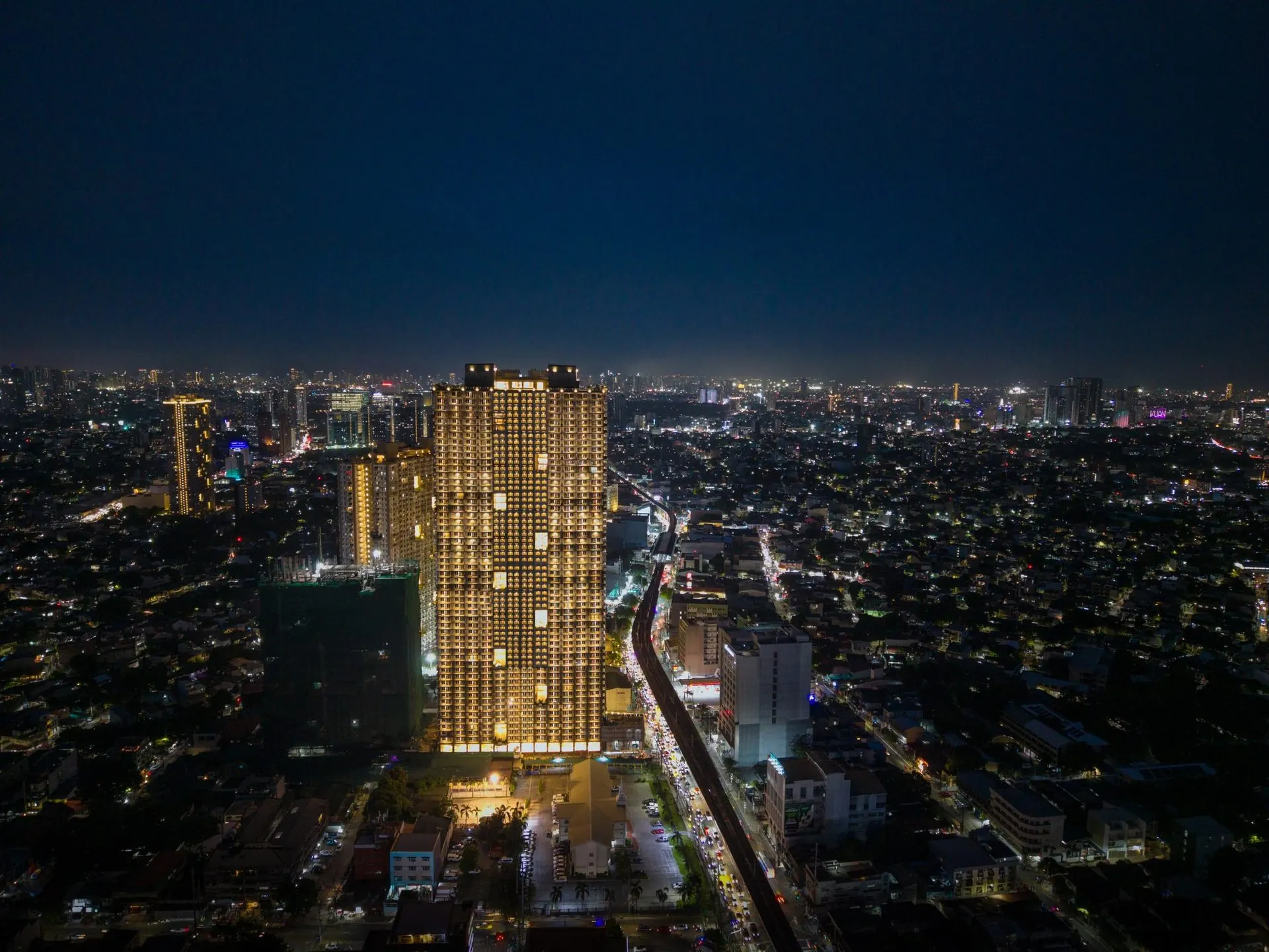 The Oriana North Tower at night — Ready-for-Occupancy DMCI Homes condominium on Aurora Boulevard, Quezon City